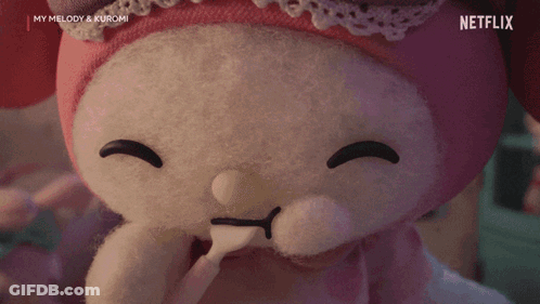 A Stuffed Animal With Heart Shaped Eyes And A Spoon In Its Mouth Is From Netflix . GIF