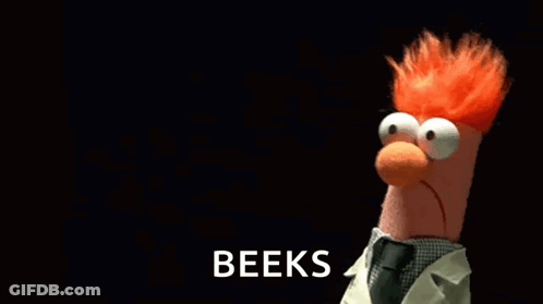 A Stuffed Animal With Red Hair Is Holding A Microphone In Front Of A Black Background That Says Beeks GIF