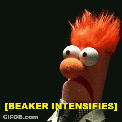 A Stuffed Animal With Red Hair Says Beaker Intensifies In Yellow GIF