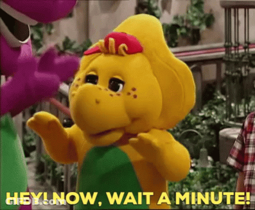 A Stuffed Animal With The Words Hey Now Wait A Minute Written On It GIF