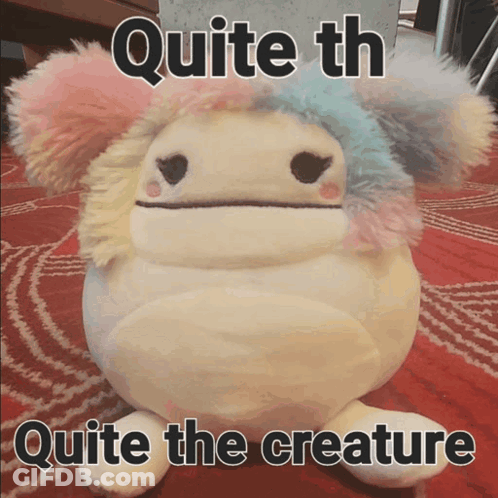 A Stuffed Animal With The Words Quite Th Quite The Creature Written On It GIF