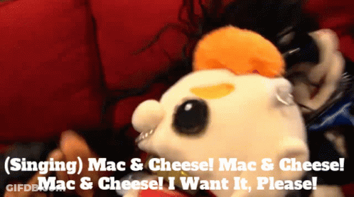 A Stuffed Animal With The Words Singing Mac & Cheese On It GIF