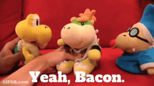 A Stuffed Animal With The Words Yeah Bacon On The Bottom GIF