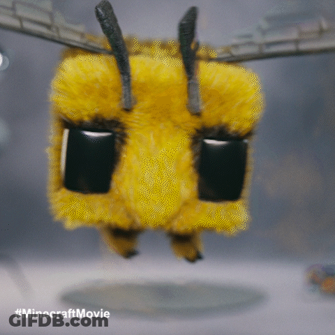A Stuffed Bee From The Minecraft Movie Flying In The Air GIF