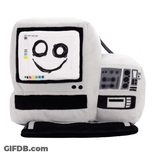 A Stuffed Computer With A Smiling Face Drawn On It GIF