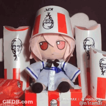 A Stuffed Doll Wearing A Kfc Bucket Hat Is Sitting In A Box GIF