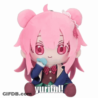 A Stuffed Doll With Pink Hair And The Words Yuriful Written On It GIF