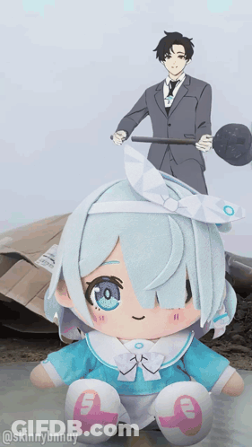 A Stuffed Doll With The Number 9 On It Sits In Front Of A Man In A Suit GIF