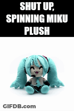 A Stuffed Hatsune Miku Is Sitting On A White Surface With A Black Background That Says Shut Up Spinning Miku Plush GIF