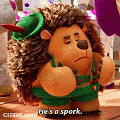 A Stuffed Hedgehog With The Words He 'S A Spork Written On It GIF