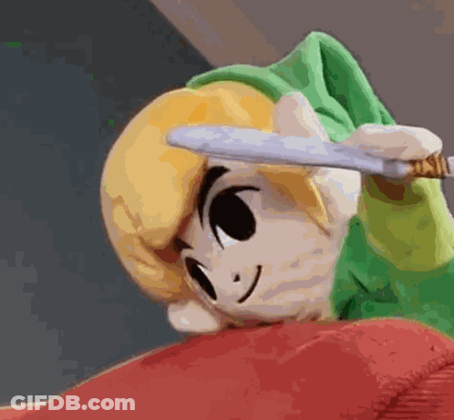 A Stuffed Link Is Holding A Knife In His Hand . GIF