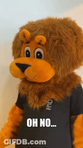 A Stuffed Lion Wearing A Black Shirt That Says Oh No On It GIF