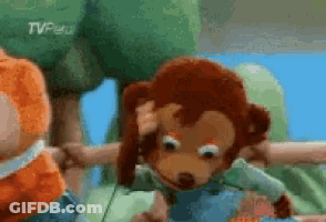 A Stuffed Monkey Is Holding Another Stuffed Monkey 'S Head In A Cartoon Scene . GIF