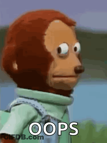 A Stuffed Monkey Is Making A Funny Face With The Words Oops Written On It . GIF