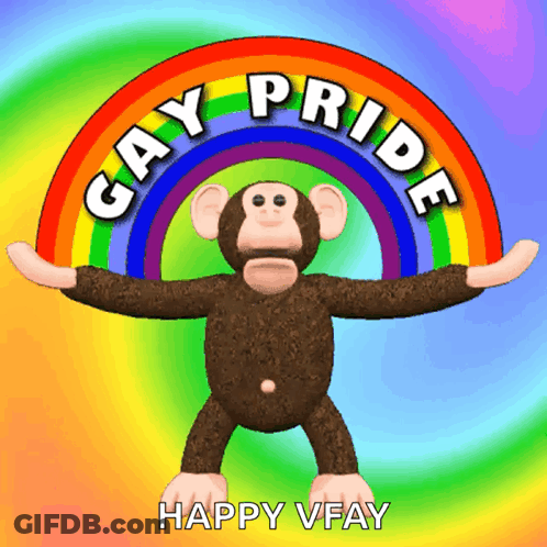 A Stuffed Monkey Stands In Front Of A Rainbow With The Words Gay Pride Written Around It GIF