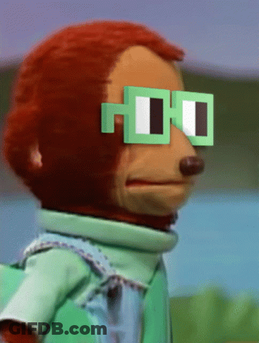 A Stuffed Monkey Wearing Green Square Glasses GIF