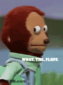A Stuffed Monkey With The Words " What The Fluff " On The Bottom GIF