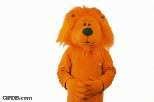 A Stuffed Orange Lion Mascot With The Word Lions On The Front GIF