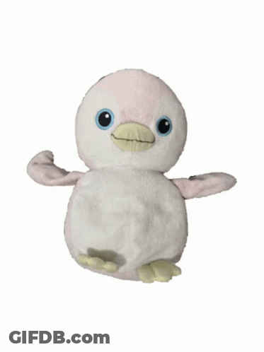 A Stuffed Penguin With A Yellow Beak Is Sitting On A White Background GIF