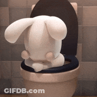 A Stuffed Rabbit Is Sitting On A Toilet GIF