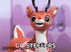 A Stuffed Reindeer With A Red Nose Is Sitting In A Pink Box And Saying `` Go Steelers '' . GIF