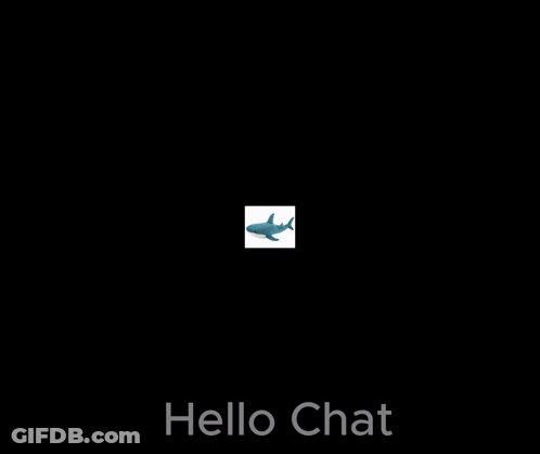 A Stuffed Shark Is Sitting On A White Surface With The Words Hello Chat Above It . GIF