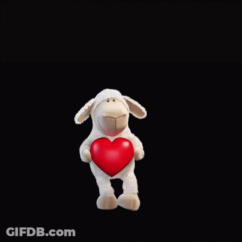 A Stuffed Sheep Holding A Red Heart With The Words " Ewe Are One In A Million " Above It GIF