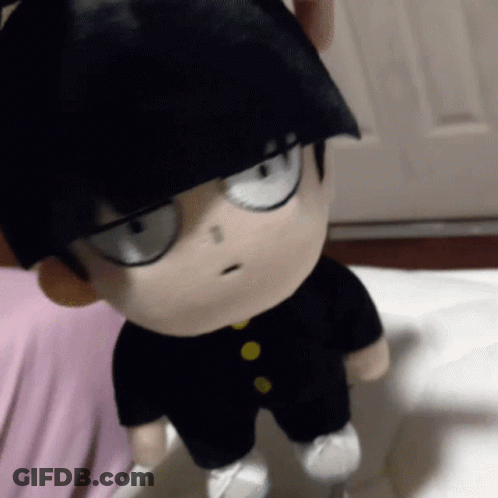 A Stuffed Toy Of A Boy With Black Hair And Glasses GIF