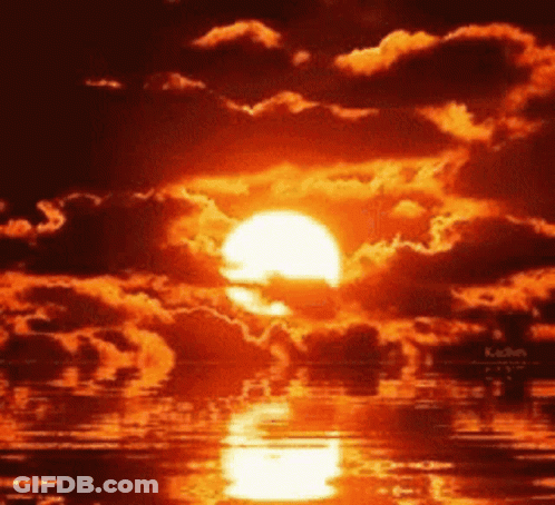A Sunset Over A Body Of Water With A Lot Of Clouds GIF