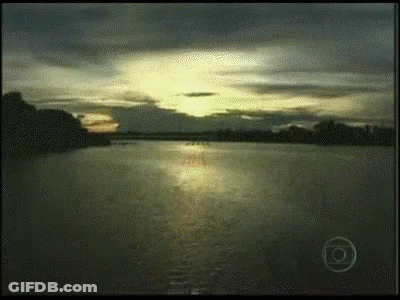 A Sunset Over A Body Of Water With The Letter O On The Bottom Left GIF