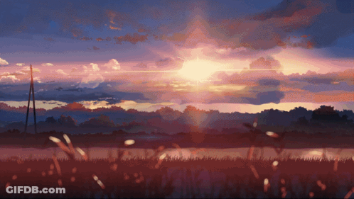 A Sunset With The Sun Shining Through The Clouds Over A Field GIF
