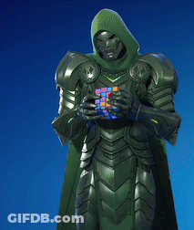 A Superhero With A Green Cape And Hood Is Holding A Cube In His Hands GIF
