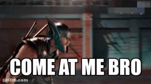 A Superhero With The Words Come At Me Bro Written On The Screen GIF