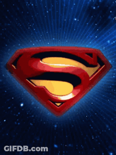 A Superman Logo Against A Blue Background With Rays Coming Out Of It GIF