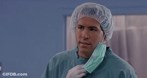 A Surgeon Is Wearing A Surgical Cap And Mask And Asking But Why . GIF