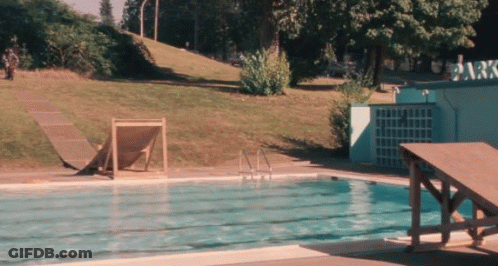 A Swimming Pool With A Sign That Says ' Park ' On It GIF