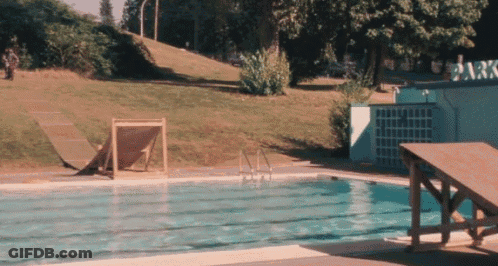 A Swimming Pool With A Sign That Says Park GIF