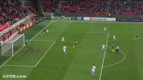 A Swiss Uote Sign Is Behind A Soccer Goalie GIF