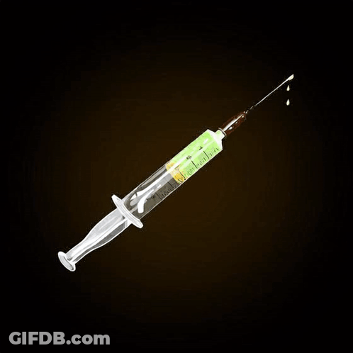 A Syringe With A Drop Of Green Liquid On It GIF