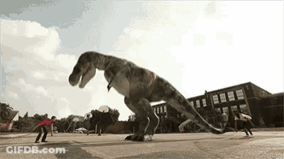 A T-Rex Is Playing Basketball With A Group Of Kids In Front Of A School . GIF