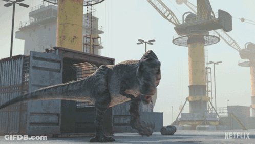 A T-Rex Is Standing In Front Of A Netflix Building GIF