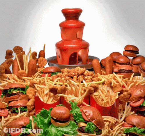 A Table Full Of Hamburgers French Fries And Chicken Nuggets GIF