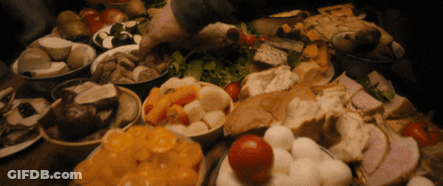 A Table Topped With Bowls Of Food Including Tomatoes And Bread GIF