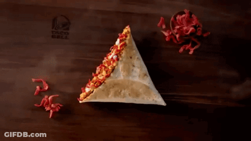 A Taco Bell Ad Shows A Grilled Stuff Nacho For 1.29 GIF