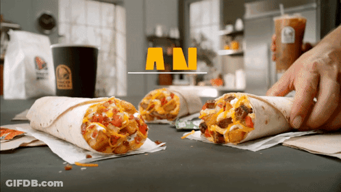 A Taco Bell Ad Shows A Person Holding A Cup Of Coffee GIF