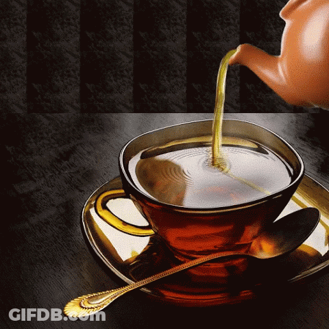A Teapot Pouring Tea Into A Cup With A Spoon GIF