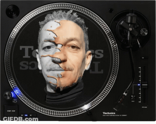 A Technics Turntable With A Face On It GIF