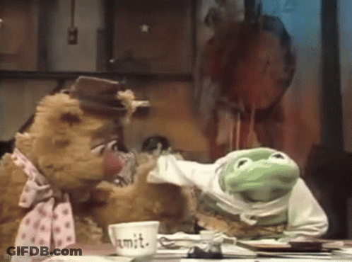 A Teddy Bear And A Frog Are Sitting At A Table With A Cup That Says Mit . GIF