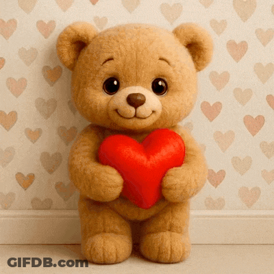 A Teddy Bear Holds A Red Heart In Front Of A Wall With Hearts On It GIF