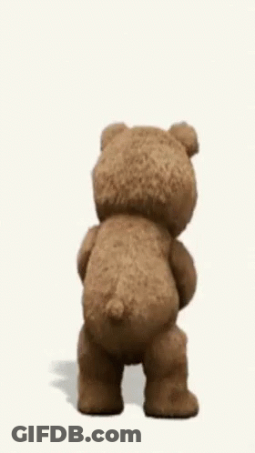 A Teddy Bear Is Dancing And Holding A Book In His Hand . GIF